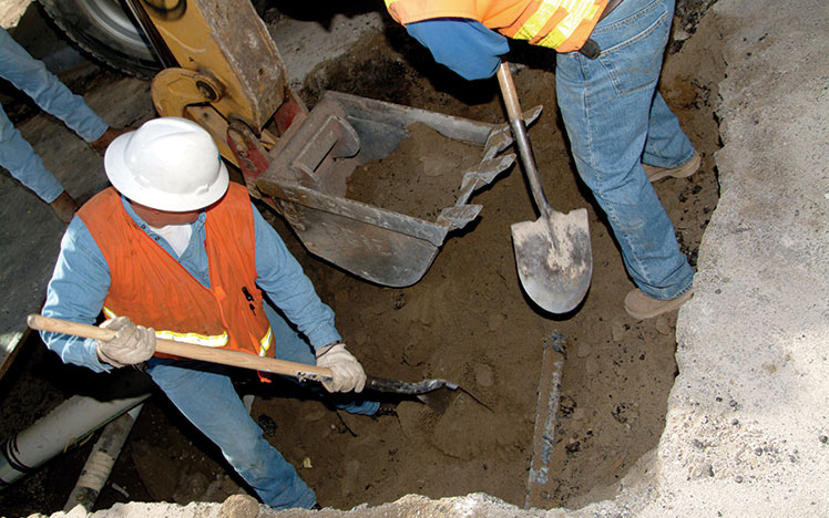 Workers digging